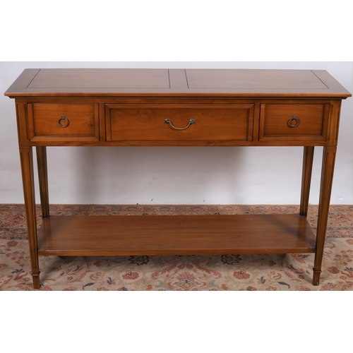 50 - A Du Pluessis CHERRYWOOD CONSOLE TABLE of rectangular outline the shaped top above three frieze draw... 