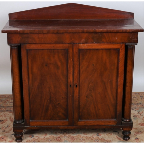 17 - A 19TH CENTURY MAHOGANY SIDE CABINET of rectangular outline the shaped top above a pair of cupboards... 