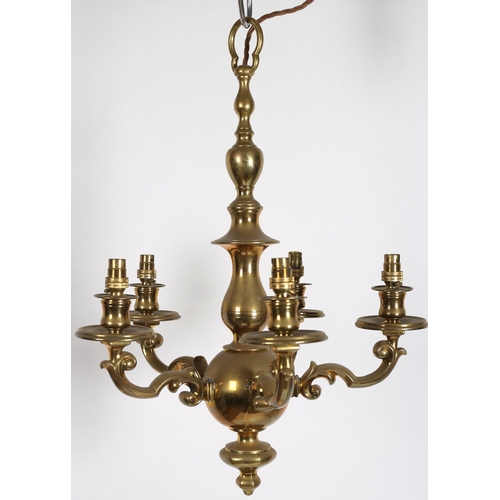 619 - A 19TH CENTURY BRASS FIVE BRANCH CHANDELIER the baluster column issuing five scroll arms with circul... 