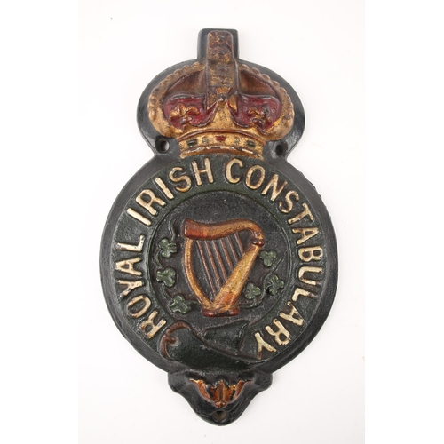 28 - Edwardian Royal Irish Constabulary barracks sign. A painted, cast iron relief sign, the badge of the... 
