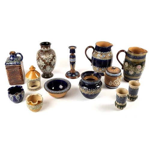 299 - Doulton Lambeth. A collection of Doulton Lambeth ware including two large water jugs, a candlestick,... 