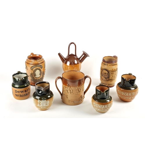 307 - A collection of Royal Doulton stoneware jugs including three Dewar's Whisky jugs, a General Gordon c... 