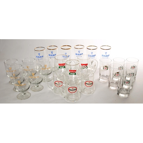 320 - A collection of 1970s and 1980s pub glassware to include 6 Guinness half pint glasses, 6  Harp half ... 