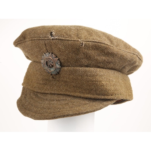 61 - Early 20th century Irish Army other-ranks uniform cap. The bull-wool, peaked cap with Oglaigh na hÉi... 