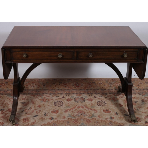 42 - A 19TH CENTURY MAHOGANY AND ROSEWOOD CROSSBANDED SOFA TABLE of rectangular outline the shaped top wi... 