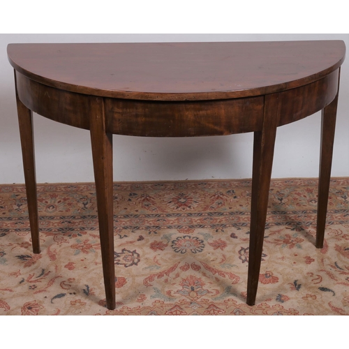 50 - A 19TH CENTURY MAHOGANY SIDE TABLE of demi lune outline the shaped top above a moulded apron on squa... 