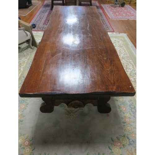 53 - A GOOD PINE REFECTORY DESIGN TABLE of rectangular outline the shaped top on pierced end stand suppor... 