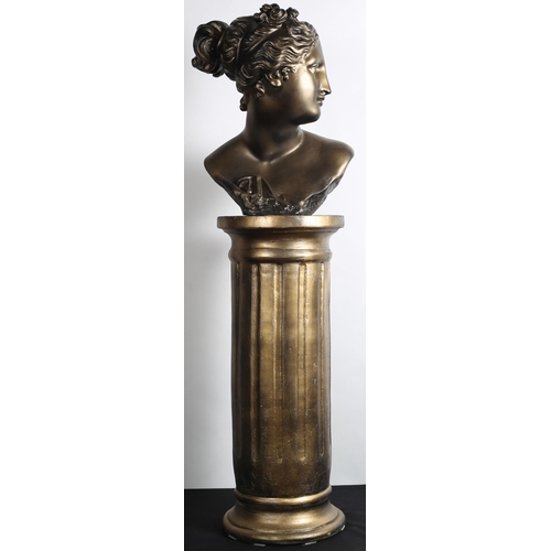 86 - A COMPOSITION GILT BUST of a female on a circular pedestal with fluted frieze and circular foot 
115... 