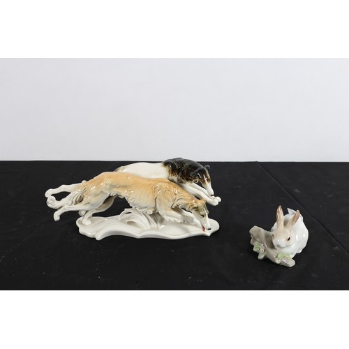 116 - AN AUSTRIAN CHINA GROUP modelled as two borzoi dogs together with a Lladro figure modelled as a rabb... 