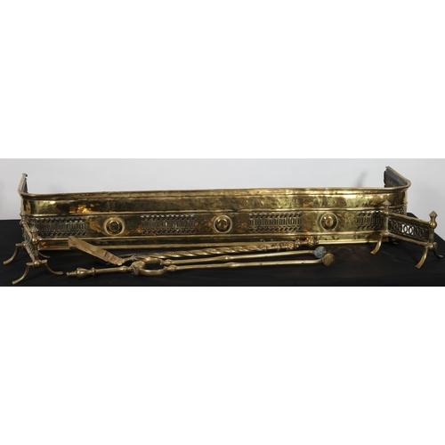 131 - A 19TH CENTURY PIERCED BRASS FENDER 
20cm (h) x 127cm (w) x 33cm (d)
together with three 19th centur... 