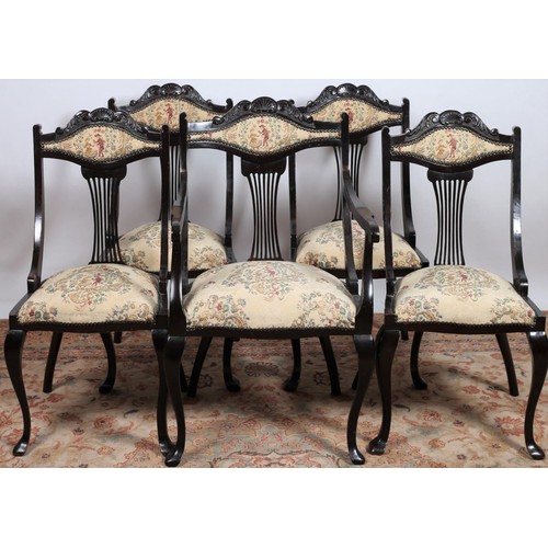 245 - A PAIR OF EDWARDIAN CARVED MAHOGANY SIDE CHAIRS each with a pierced C-scroll top rail with pierced s... 