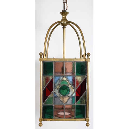 178 - A 19TH CENTURY BRASS LEAD GLASS AND COLOUR GLASS SINGLE LIGHT LANTERN of square form with tubular su... 