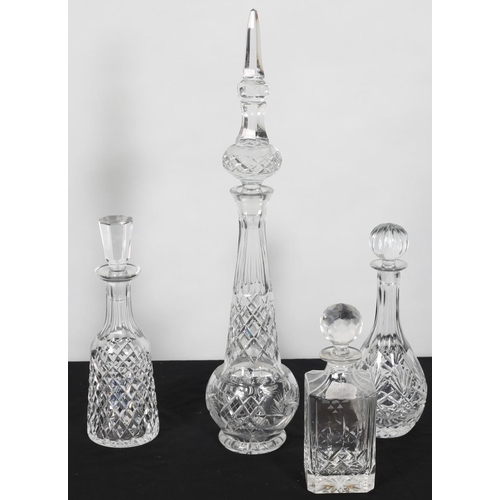 64 - FOUR CUT GLASS DECANTERS with stoppers