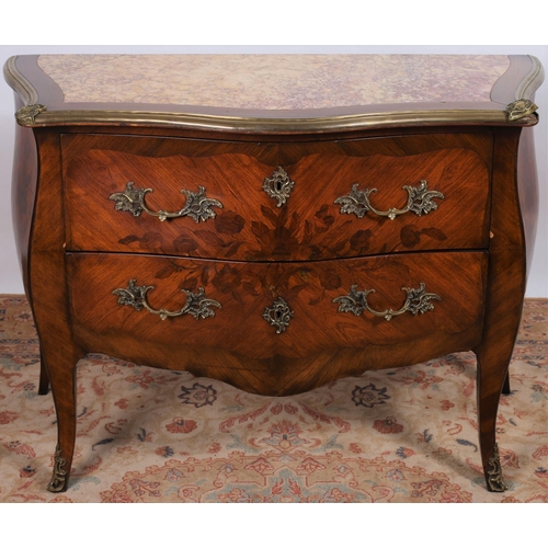 186 - A CONTINENTAL KINGWOOD MARQUETRY GILT BRASS MOUNTED AND MARBLE COMMODE of serpentine outline the sha... 