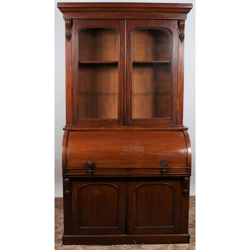 187 - A 19TH CENTURY MAHOGANY CYLINDER FRONT LIBRARY BOOKCASE the moulded cornice above a pair of glazed d... 