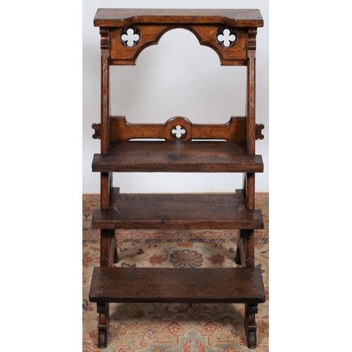 224 - A GOTHIC DESIGN OAK FOUR THREAD LIBRARY STEPS with pierced Gothic tracery on moulded supports
89cm (... 