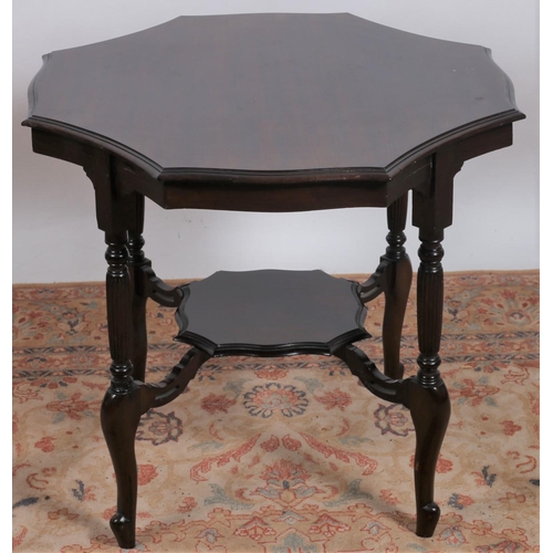 232 - A VINTAGE MAHOGANY OCCASIONAL TABLE of octagonal shaped outline raised on fluted and turned supports... 