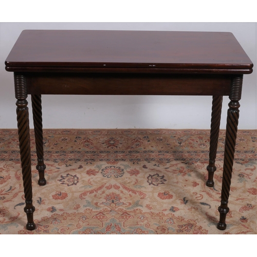 234 - A 19TH CENTURY MAHOGANY FOLDOVER SUPPER TABLE the rectangular hinged top with moulded apron on spira... 