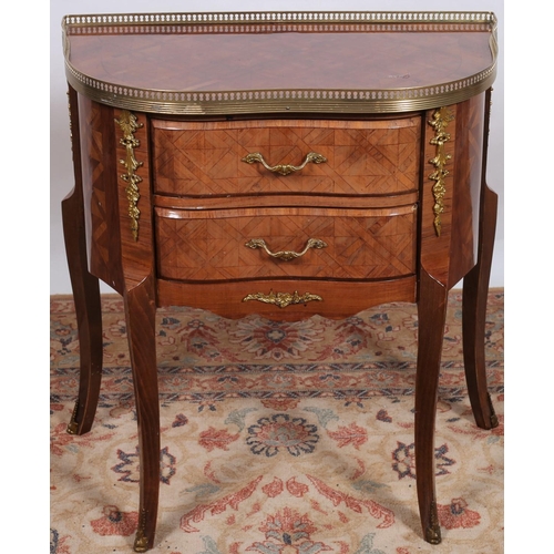 244 - A CONTINENTAL KINGWOOD AND GILT BRASS MOUNTED SIDE TABLE of rectangular bowed outline the shaped top... 