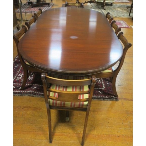 365 - A NINE PIECE REGENCY DESIGN MAHOGANY AND BRASS INLAID DINING ROOM SUITE comprising eight chairs, inc... 