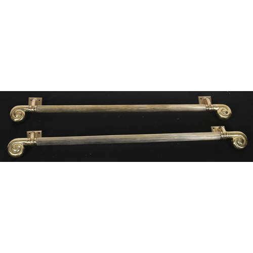 374 - A FINE PAIR OF REGENCY BRASS DOOR PULLS each with a reeded column and scroll finials with rectangula... 