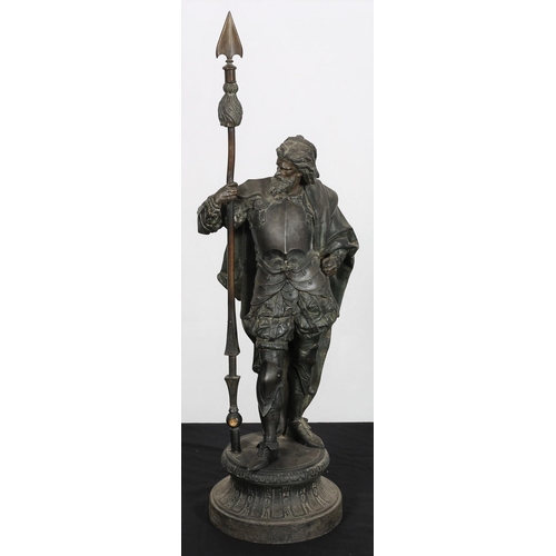 378 - A SPELTER FRENCH FIGURE modelled as a courtier shown standing on a circular platform 63cm (h)