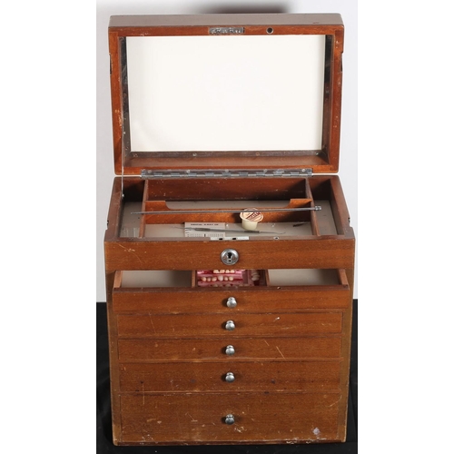 383 - A VINTAGE STAINED WOOD DENTIST'S CHEST of rectangular outline with chrome carrying handle the hinged... 