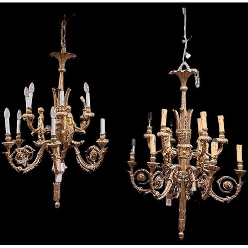 409 - A PAIR OF CONTINENTAL GILT METAL TWELVE BRANCH CHANDELIERS hung in two registers with foliate moulde... 