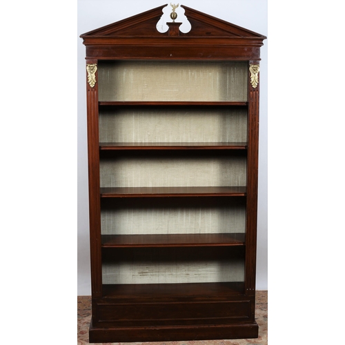 436 - A GEORGIAN DESIGN MAHOGANY AND GILT BRASS MOUNTED OPEN FRONT BOOKSHELF the architectural pediment ab... 