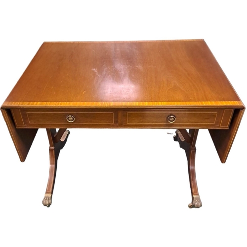 447 - A GEORGIAN DESIGN MAHOGANY AND SATINWOOD CROSSBANDED SOFA TABLE the rectangular hinged top with two ... 