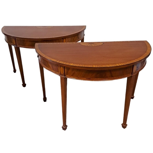 448 - A GOOD PAIR OF GEORGIAN DESIGN MAHOGANY AND SATINWOOD CROSSBANDED SIDE TABLES each of demi lune outl... 