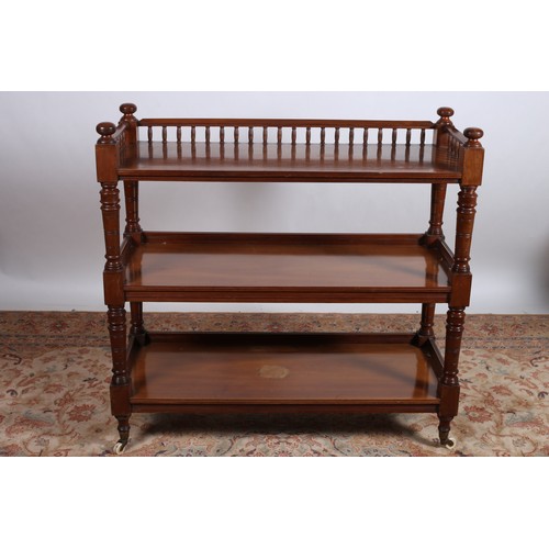 491 - AN EDWARDIAN MAHOGANY THREE TIER DUMBWAITER the moulded spindle three quarter gallery above two open... 