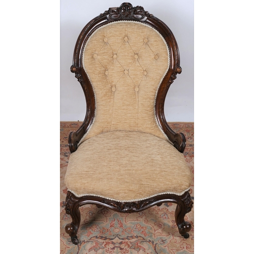 496 - A 19TH CENTURY CARVED MAHOGANY AND UPHOLSTERED LADY'S CHAIR the carved top rail above a buttoned uph... 