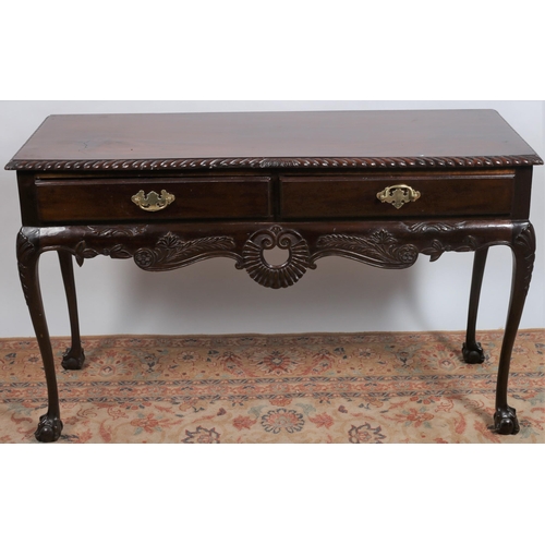 506 - A CHIPPENDALE DESIGN MAHOGANY SIDE TABLE of rectangular outline the shaped top with gadrooned rim ab... 