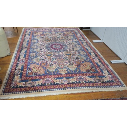 551 - A VINTAGE KASHMAR IRANIAN PICTORIAL RUG the beige and blue ground with central panel filled with sty... 