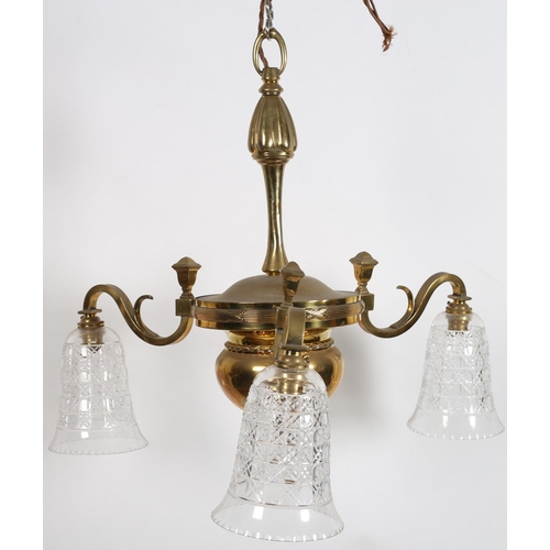 785 - A 19TH CENTURY BRASS THREE BRANCH CHANDELIER the baluster column issuing three scroll arms with cut ... 