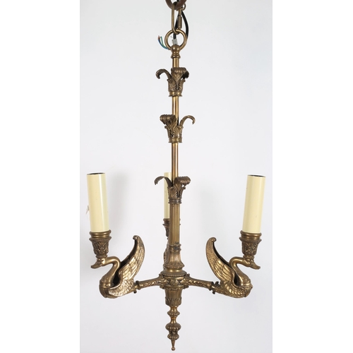 787 - A VINTAGE BRASS THREE BRANCH CHANDELIER the reeded and foliate central column issuing three foliate ... 