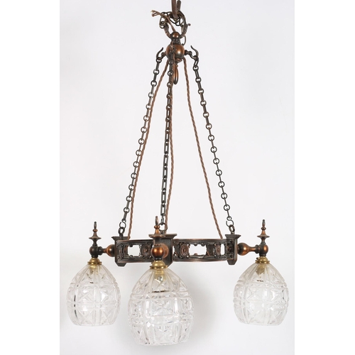 781 - A VINTAGE OXIDISED THREE BRANCH CHANDELIER the pierced circlet with baluster arms issuing three cut ... 