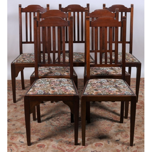 803 - A SET OF EIGHT VINTAGE MAHOGANY DINING CHAIRS each with a shaped top rail and vertical splats with u... 