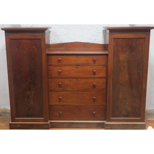 745 - A 19TH CENTURY MAHOGANY COMBINATION WARDROBE the central section containing five long graduated draw... 