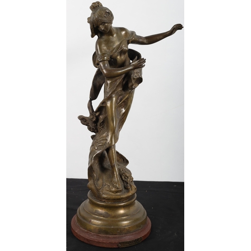 668 - AFTER MOREAU a bronze figure modelled as a female shown standing on a naturalistic base, raised on a... 