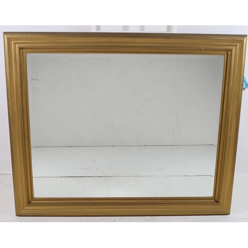 684 - A GILT FRAME MIRROR the rectangular bevelled glass plate within a moulded frame 
117cm (h) x 138cm (... 