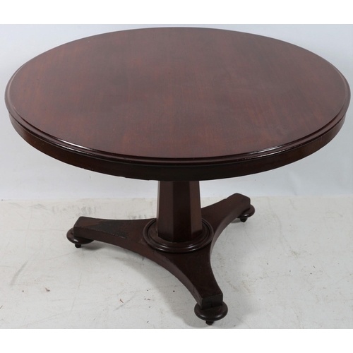 691 - A 19TH CENTURY MAHOGANY POD TABLE of circular outline the shaped top above a faceted column on shape... 