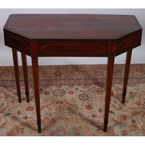 696 - A 19TH CENTURY MAHOGANY CROSSBANDED FOLDOVER CARD TABLE of rectangular outline the shaped top with c... 