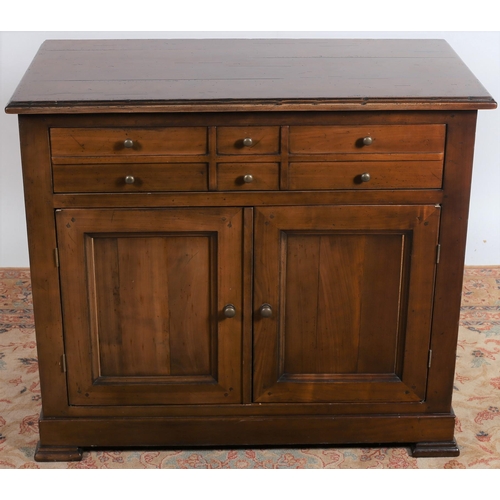 10 - A CHERRYWOOD SIDE CABINET of rectangular outline the shaped top above a hinged compartment and cupbo... 