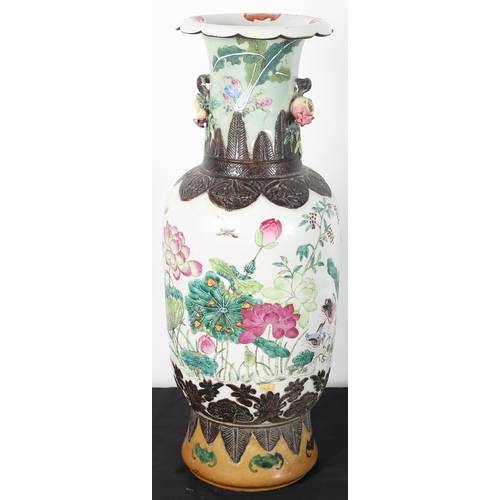 100 - AN ORIENTAL CHINA VASE the white ground with foliate and flowerhead decoration with fruiting handles... 