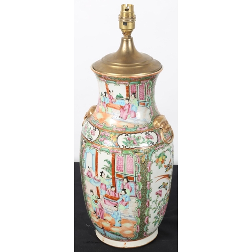 101 - A CANTONESE TABLE LAMP of baluster form with gilt Dog of Foo ring handles 
47cm (h)