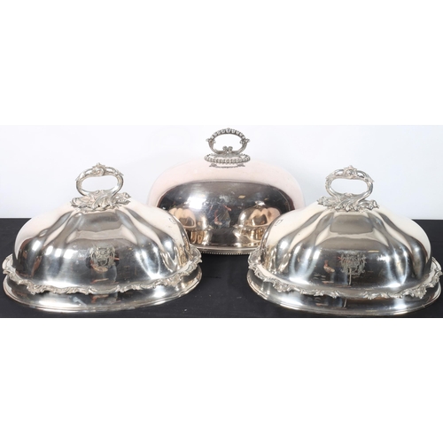 104 - A PAIR OF 19TH CENTURY SHEFFIELD PLATED MEAT COVERS each with a foliate cast handle together with a ... 