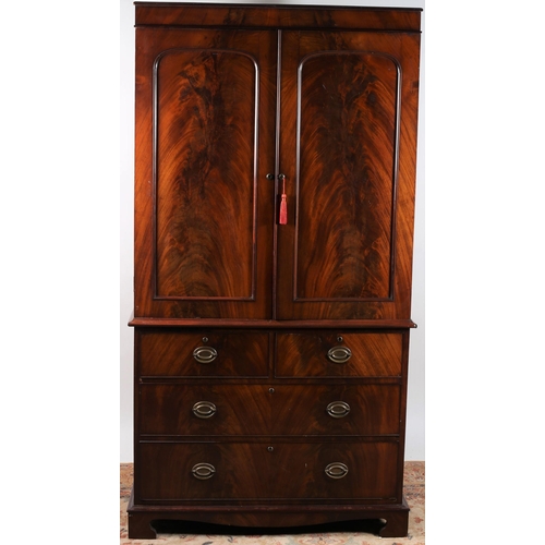 181 - A GOOD 19TH CENTURY MAHOGANY LINEN PRESS ON CHEST the moulded cornice above a pair of panelled doors... 