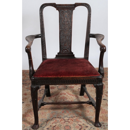 192 - AN IRISH MAHOGANY ARMCHAIR c.1740 the carved top rail with carved vertical splat and upholstered dro... 